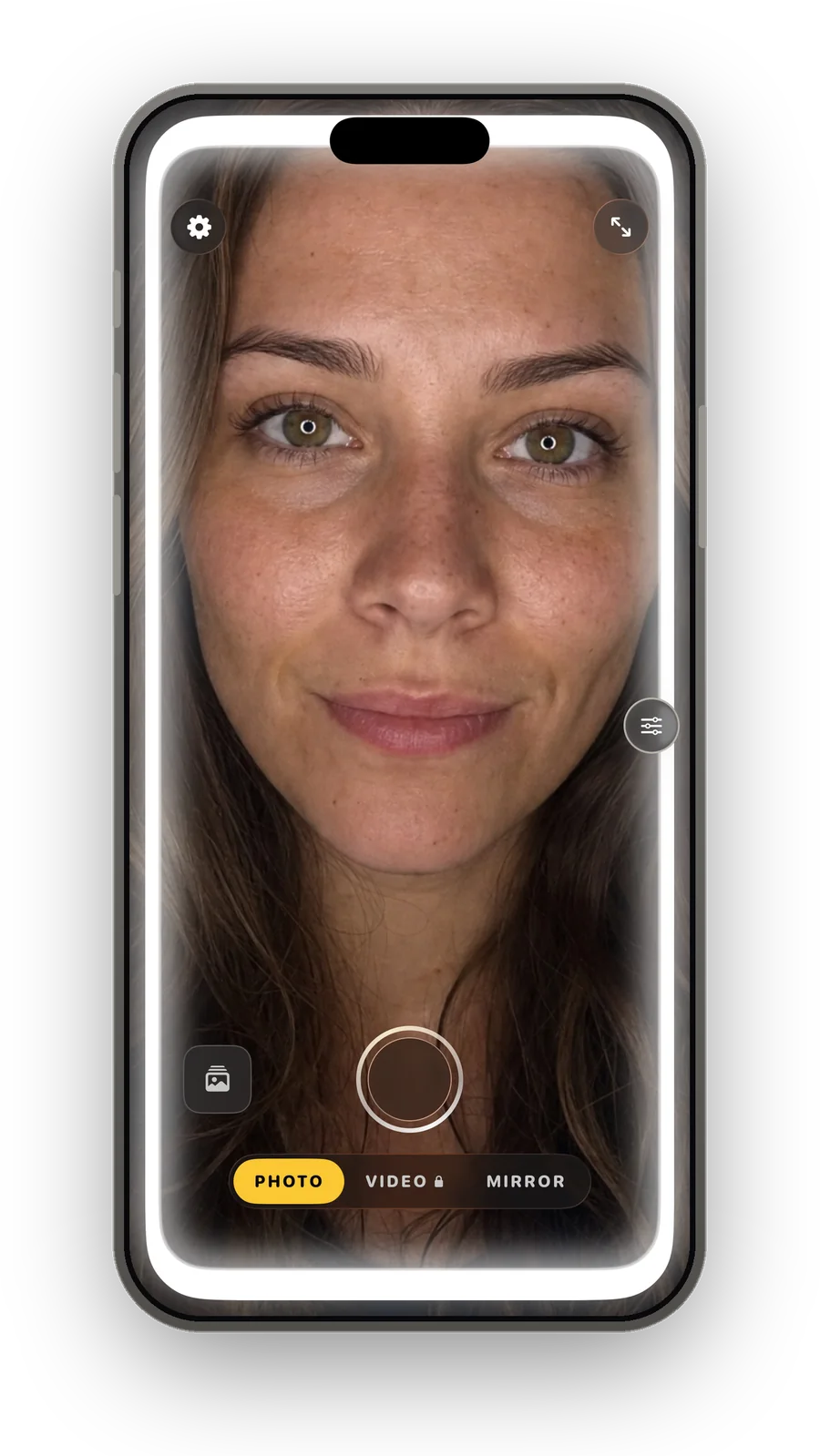 An iPhone running Halora in Photo mode, the whole screen glowing as a ring light on a face.
